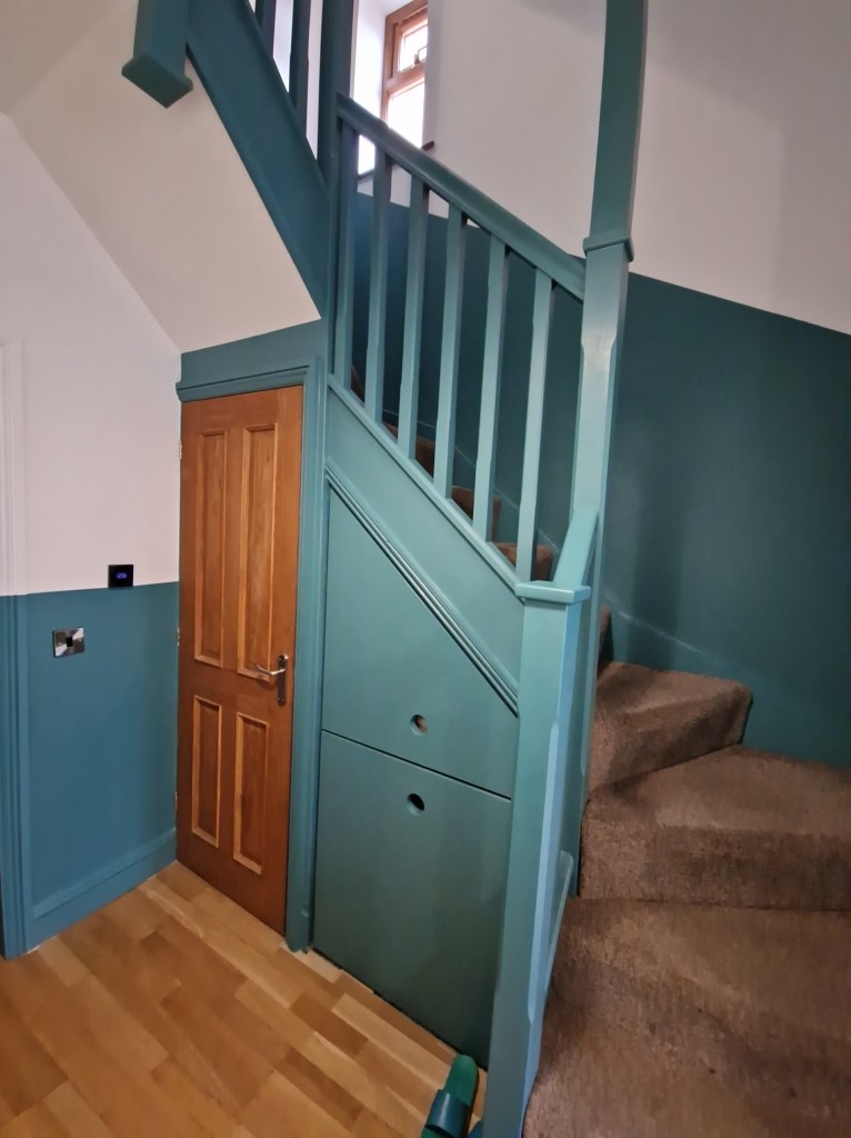 The wooden door at the base of the staircase is a little feature providing entry to the room below. The structure has been...